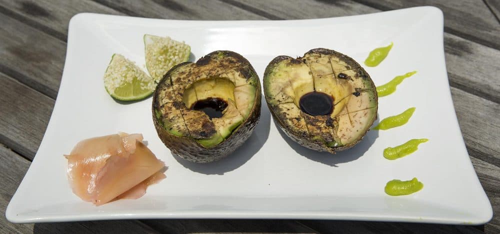 Kathy's grilled avocado with tamari, pickled ginger and lime with sesame seeds. (Robin Lubbock/WBUR)