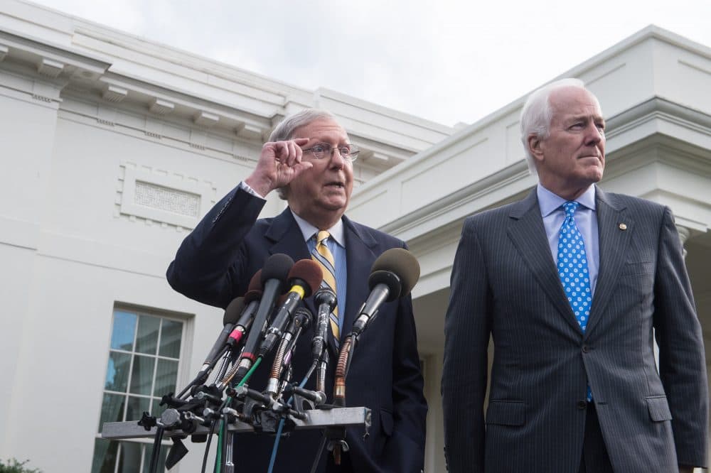 Senate Majority Leader Mitch McConnell (left) and Majority Whip John Cornyn speak to the press outside the West Wing of the White House after Republican senators met with President Trump to discuss the health care bill in Washington, D.C., on June 27, 2017. (Nicholas Kamm/AFP/Getty Images)
