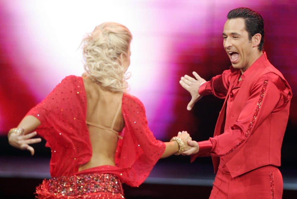 Auto racer Helio Castroneves, right, performs with Julianne Hough on the TV show Dancing With The Stars. (AJ Mast/AP)
