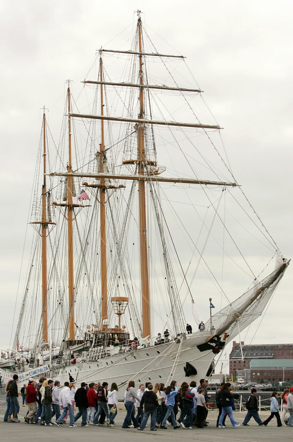 Visitors to the Charlestown Navy Yard walk in front of the Chilean tall ship B.E. Esmeralda, in Boston in 2005. (Steven Senne/AP)