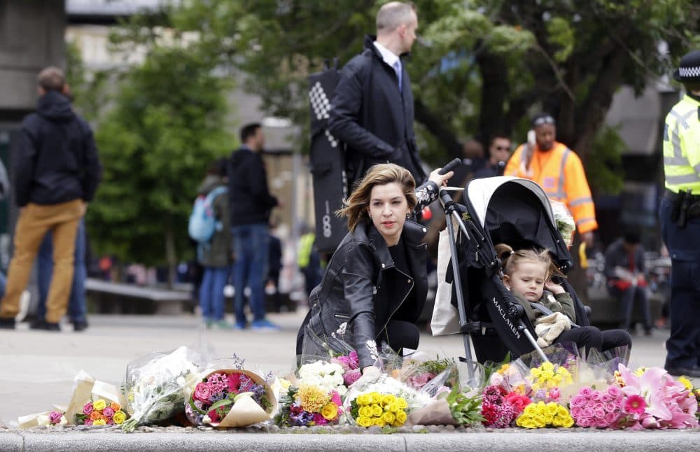What's a parent to do? We have already emphasized the importance of wearing a seatbelt and a bike helmet, writes Holly Robinson. Now we have to remind our children to wear running shoes in case there's an attack. In this photo, a woman lays a bouquet of flowers in the London Bridge area of London, Monday, June 5, 2017. Police arrested several people and are widening their investigation after a series of attacks described as terrorism killed several people and injured more than 40 others in the heart of London on Saturday. (Alastair Grant/ AP)