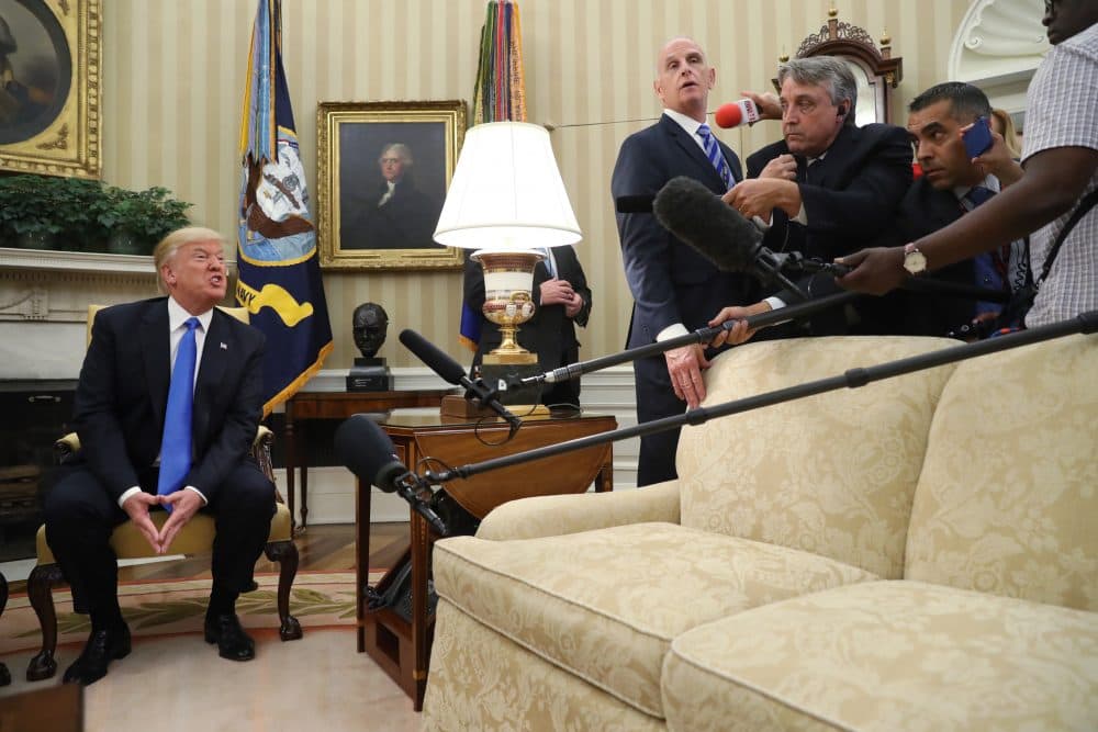 President Trump answers a question from the media, during a meeting with Romanian President Klaus Werner Iohannis, not shown, in the Oval Office at the White House, Friday, June 9, 2017. (Andrew Harnik/AP)