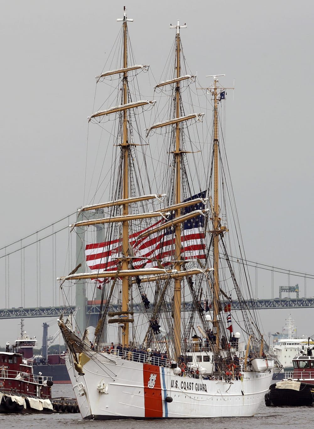 The barque Eagle sails up the Delaware River between Camden, N.J. and Philadelphia during a 2015 tall ships parade. (Matt Slocum/AP)