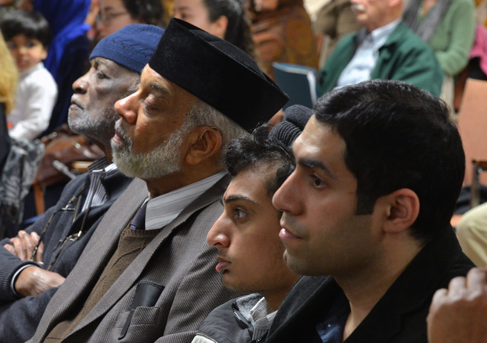 Members of the Ahmadiyya Muslim community listened as Ted Hakey apologized in the room that was marked by his bullets. (Peter Casolino/Special to the Hartford Courant)