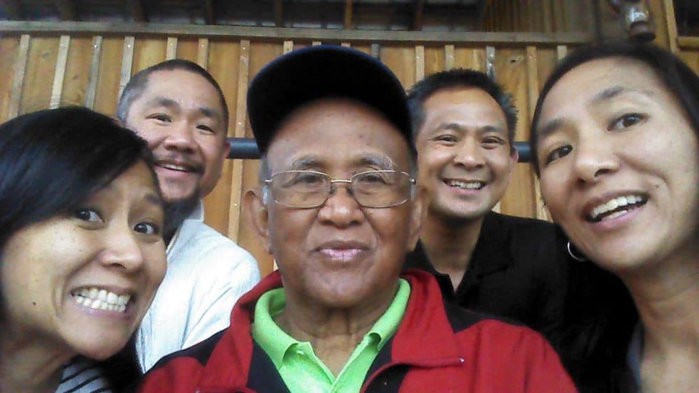 The Blanquera children with their father. From Left: Amelia, Arturo Jr., father Arturo, Ben, Ardel