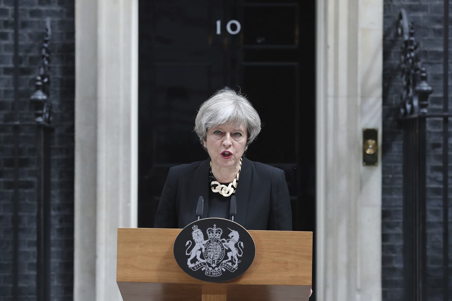 Britain's Prime Minister Theresa May makes a statement in Downing Street, London, after chairing a meeting of the Government's emergency Cobra committee following Saturday night's terrorist incident in London. Several people were killed in the terror attack at the heart of London and dozens injured. The prime minister called for a tougher stance at home against extremists. (Andrew Matthews/PA via AP)