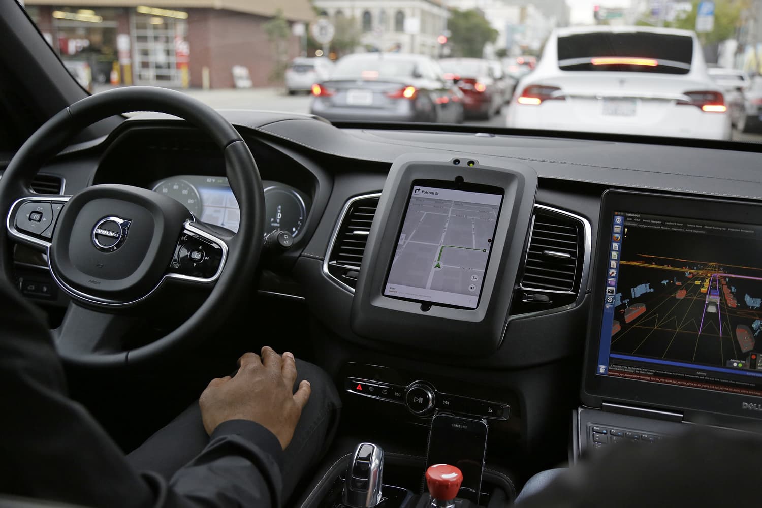 An Uber driverless car waits in traffic during a test drive in San Francisco. (Eric Risberg/AP)