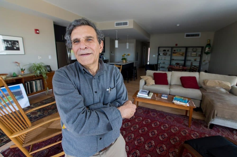 Fred Gordon stands in his apartment at the Distillery North. (Jesse Costa/WBUR)