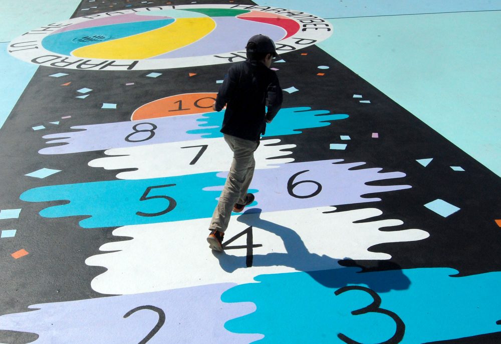 The hopscotch court running up the middle of Maria Molteni's &quot;Hard In the Paint&quot; basketball court mural at Boston's Harambee Park. (Greg Cook)