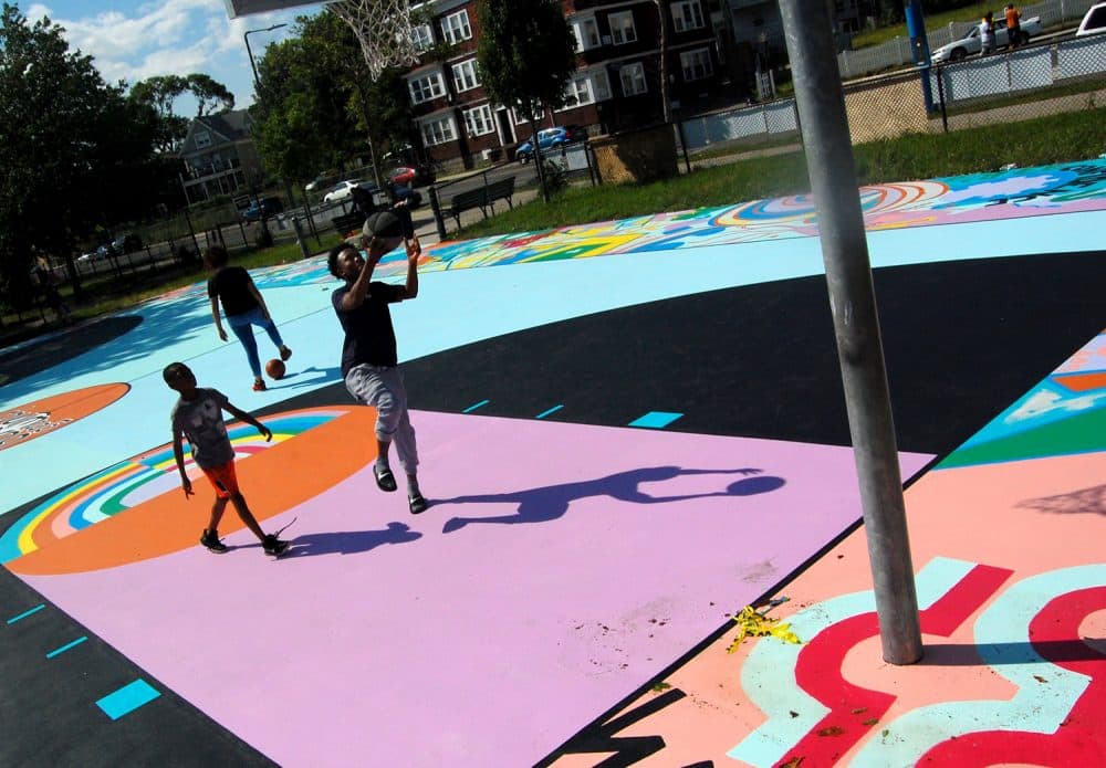 Playing on Maria Molteni's &quot;Hard In the Paint&quot; basketball court mural at Boston's Harambee Park. (Greg Cook)