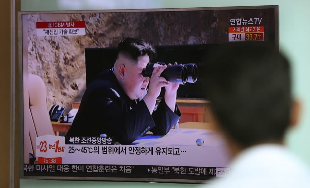 A man watches a TV screen showing a local news program reporting about North Korea's missile firing with an image of North Korean leader Kim Jong Un with a pair of binoculars, at Seoul Train Station in Seoul, South Korea, Wednesday, July 5, 2017. North Korea's leader Kim Jong Un vowed his nation would &quot;demonstrate its mettle to the U.S.&quot; and never put its weapons programs up for negotiations a day after test-launching its first intercontinental ballistic missile. (Lee Jin-man/AP)