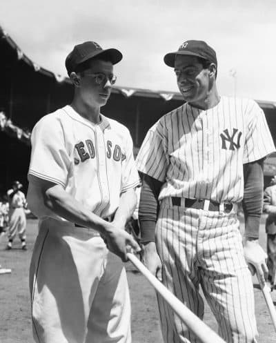 Brothers Joe DiMaggio (right) and Dominic DiMaggio speak at a spring training all-star game in 1940. (AP)