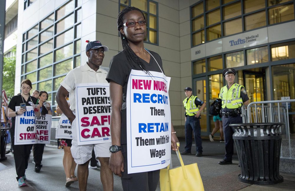 Nursing strike supporters protest at the Washington Street entrance of Tufts Medical Center. (Robin Lubbock/WBUR)