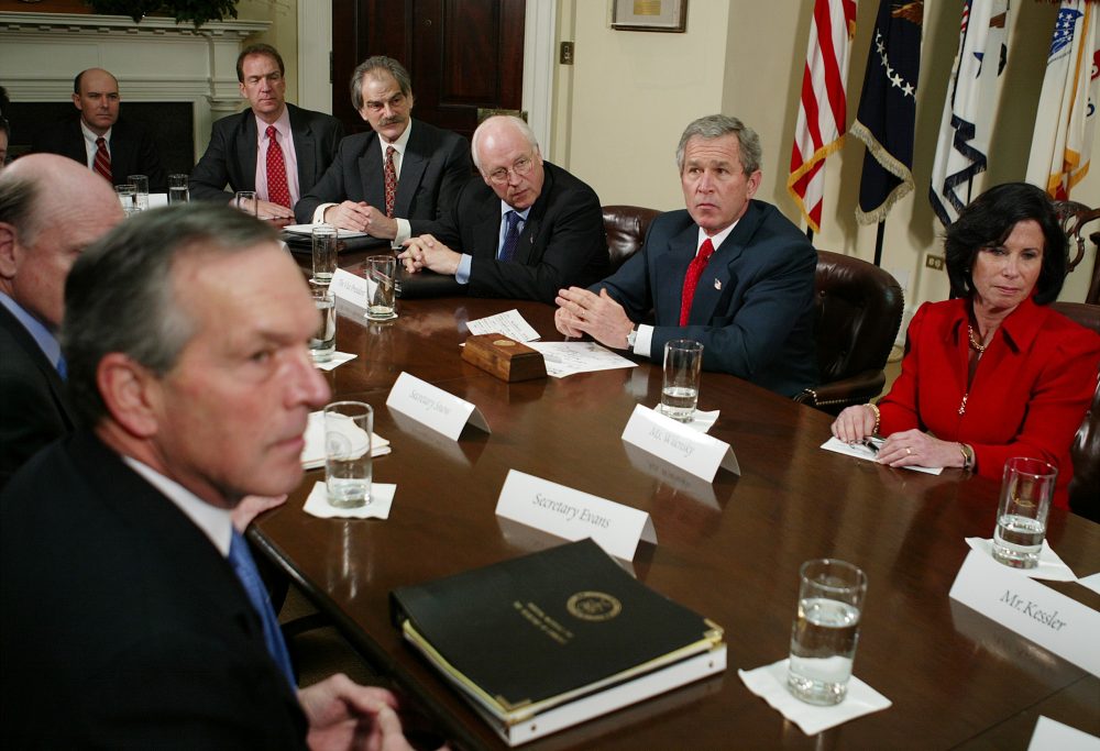 President Bush listens to a reporter's question after meeting with economists, Friday, Jan. 30, 2004, in the Roosevelt Room of the White House. Former Medicaid director Gail Wilensky is pictured at the right. (Ron Edmonds/AP)