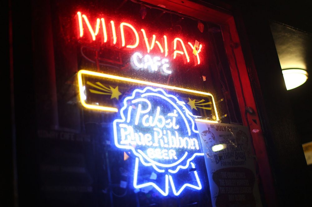 The Midway Cafe's neon sign in Jamaica Plain. (Hadley Green for WBUR)