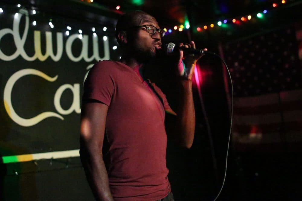 Andre Isaacs sings during Queeraoke night on Thursday, July 13. (Hadley Green for WBUR)