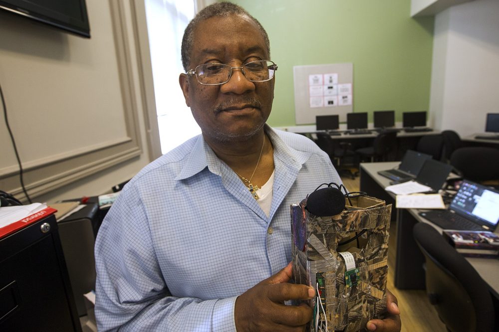 Hyde Park resident Jean Borgard displays the camera he built. (Jesse Costa/WBUR)