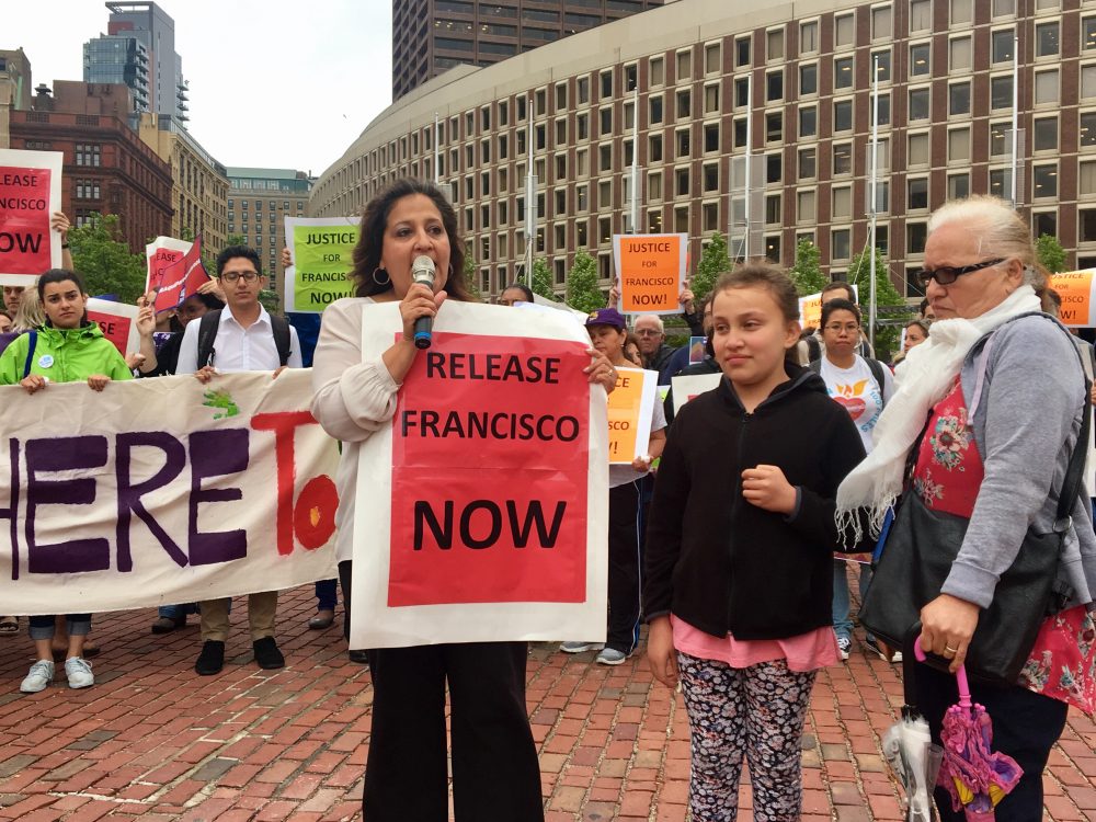 Roxana Rivera, vice president of SEIU 32BJ, introduces 10-year-old Melanie Rodriguez, Francisco Rodriguez's daughter. (Shannon Dooling/WBUR)