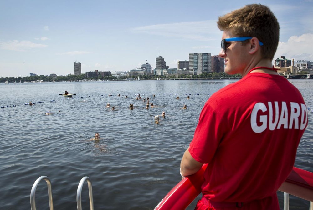 A life guard watches over swimmers in the Charles River at City Splash. (Robin Lubbock/WBUR)
