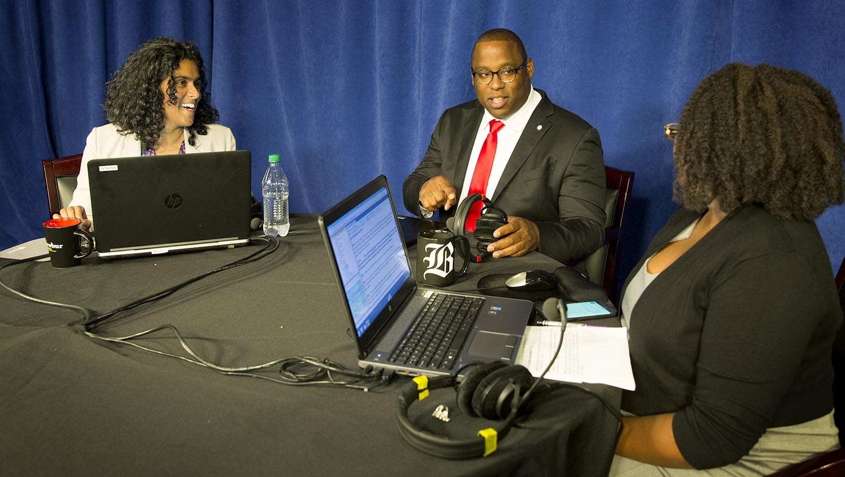 City Councilor Tito Jackson at a conversation about the Boston mayoral race. He took questions from Radio Boston's Meghna Chakrabarti, left, and Meghan Irons of the Boston Globe. (Robin Lubbock/WBUR)