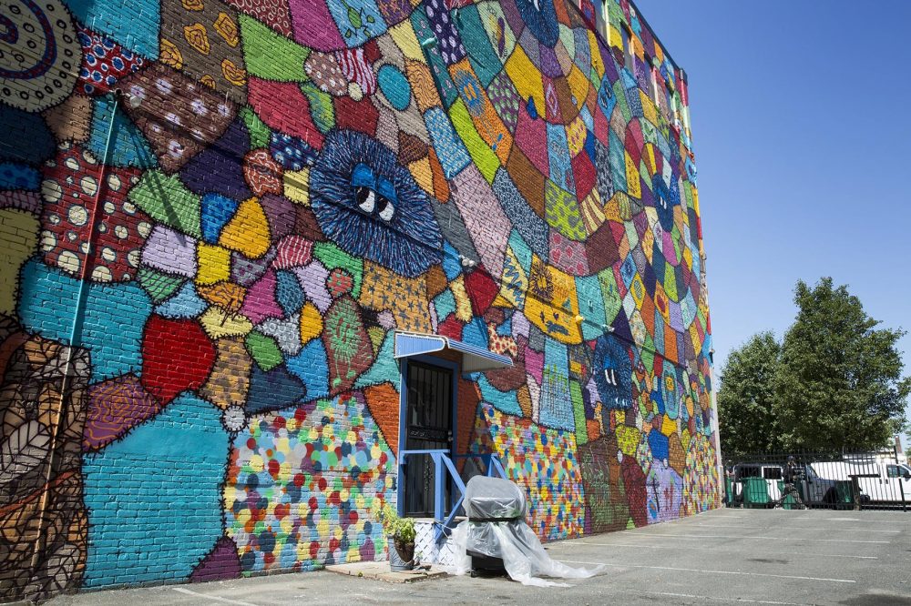 Caleb Neelon and Lena McCarthy's mural on Munroe Street in Lynn. (Robin Lubbock/WBUR)