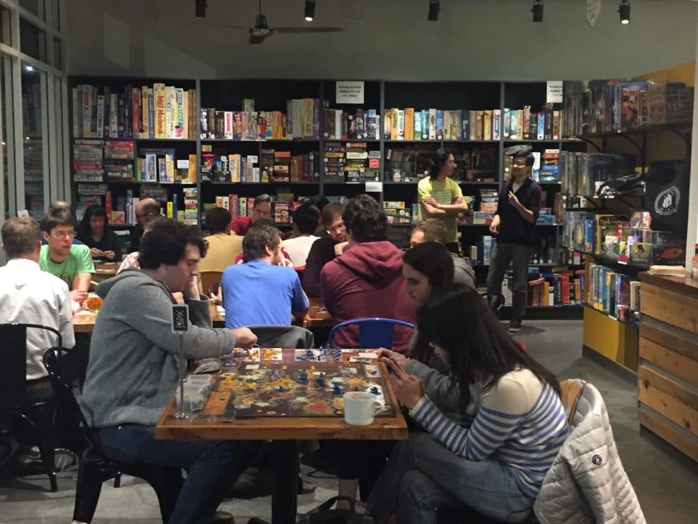 At a recent “designer night” at Victory Point Cafe, local game designers and cafe customers “play test” several game ideas designers are trying to improve upon. (Sonia Paul)