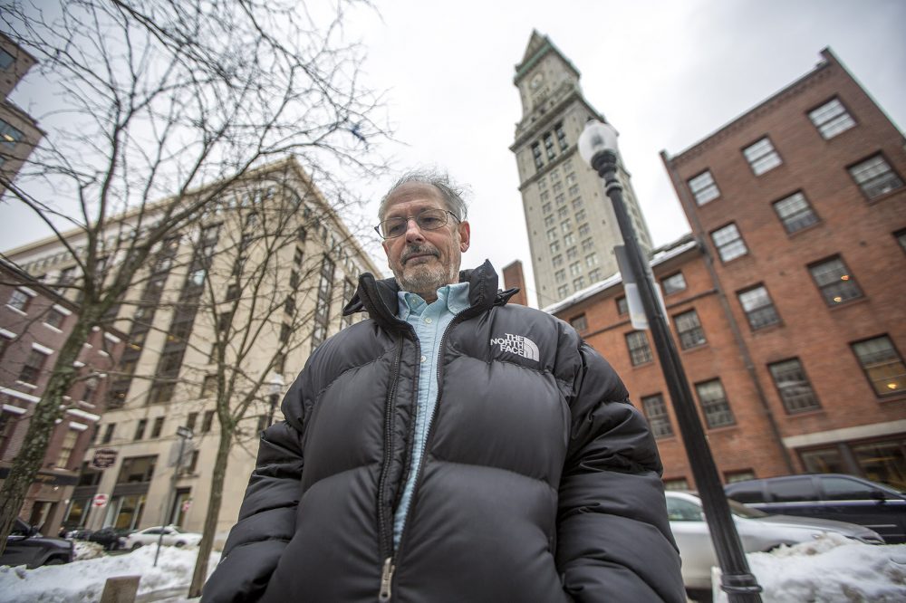 Historian Dane Morrison stands in front of Boston's Custom House, where in the 1800s chests of goods from China that had been hauled off ships were weighed on giant scales. (Jesse Costa/WBUR)