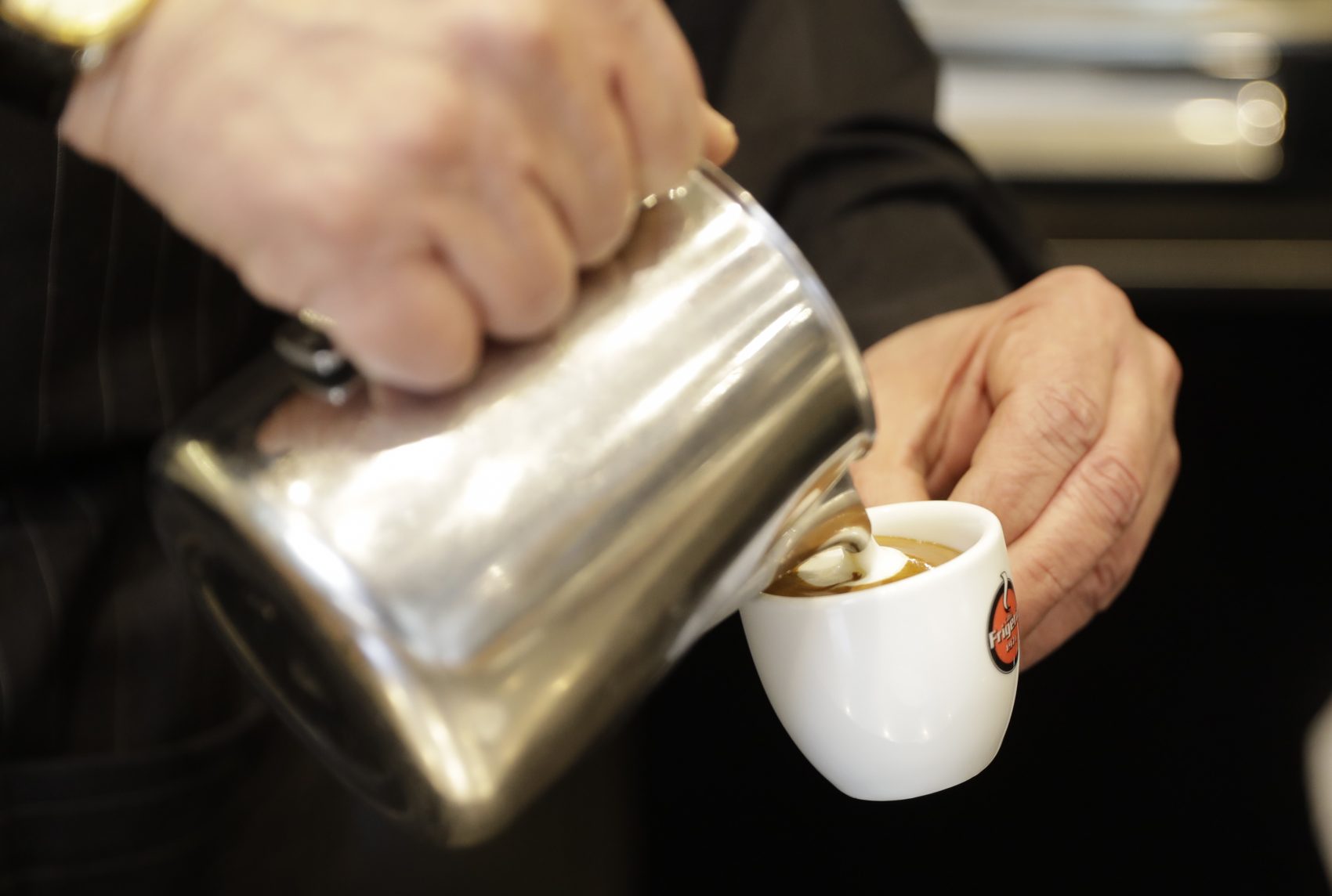 In this image taken on Feb. 27, 2017, waiter Ciro Chierchia prepares a traditional espresso macchiato at a coffee bar in Milan, Italy. (Luca Bruno/AP)