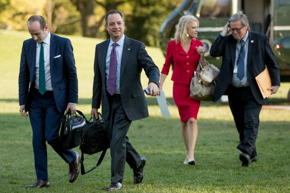 From left, President Donald Trump's White House Senior Adviser Stephen Miller, President Donald Trump's Chief of Staff Reince Priebus, Counselor to the President Kellyanne Conway, and President Donald Trump's White House Senior Adviser Steve Bannon, walk across the South Lawn after President Donald Trump arrives at the White House in Washington, Tuesday, April 18, 2017. (Andrew Harnik/AP)