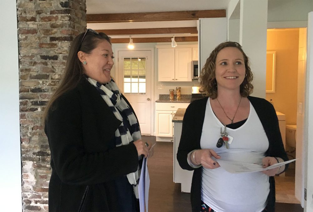 Katie McGee, right, tours a Medford home with her realtor, Sarah Glovsky. (Yasmin Amer/WBUR)