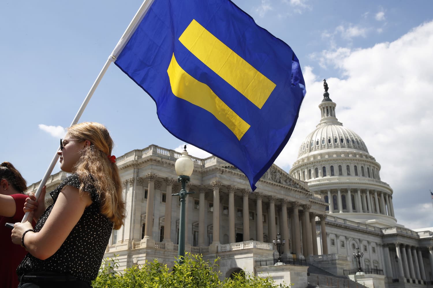 A supporter of LGBT rights holds up an "equality flag" on Capitol Hill in Washington, Wednesday, July 26, 2017. (Jacquelyn Martin/AP)