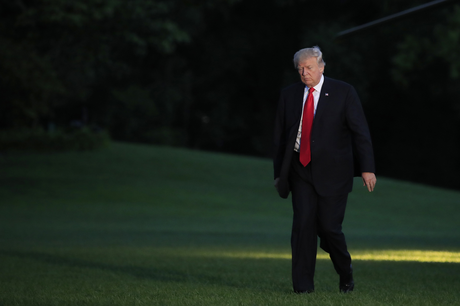 President Donald Trump walks on the South Lawn upon arrival the White House in Washington, Saturday, July 8, 2017, from the G20 Summit in Hamburg, Germany. (Manuel Balce Ceneta/AP)