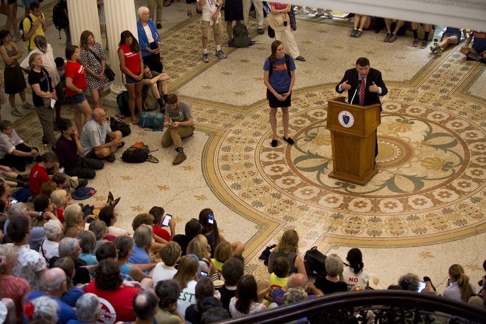 In a file photo, state Sen. Mark Pacheco addresses pipeline protesters in the State House. (Jesse Costa/WBUR)