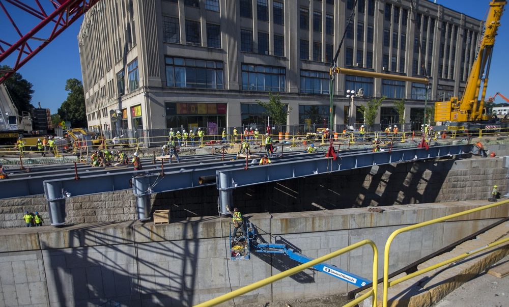 Contractors work on replacing the eastbound side of the Commonwealth Avenue Bridge on July 31, 2017. Work on the westbound side will begin July 26, 2018. (Jesse Costa/WBUR)