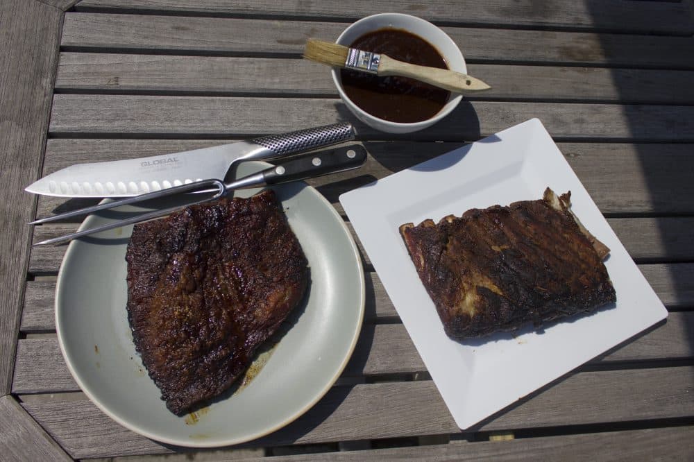 Kathy's slow-smoked Texas-style brisket (left), dry-rubbed pork ribs and best barbecue sauce. (Jackson Mitchell/Here &amp; Now)