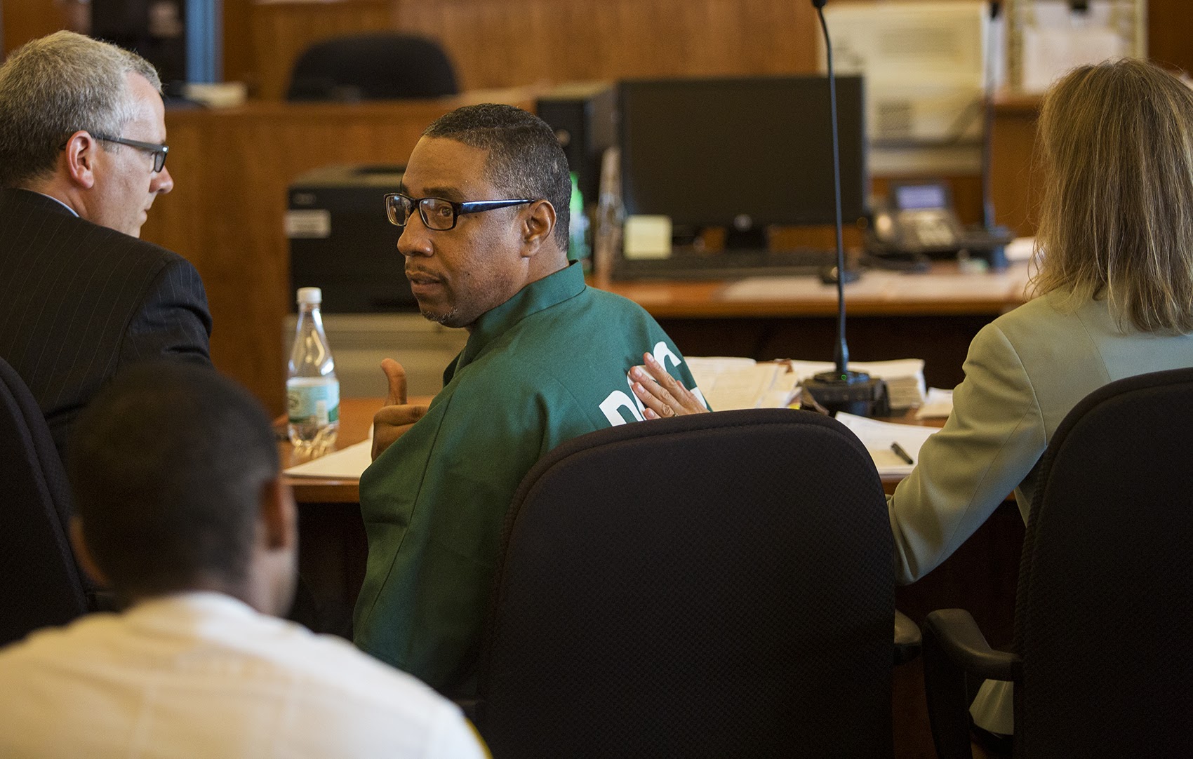 At his latest hearing at Bristol County Courthouse in Fall River.on Tuesday, Darrell Jones turns to his mother in the courtroom and tells her, "I'm OK." (Jesse Costa/WBUR)