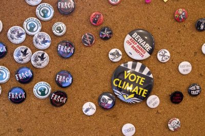 Pins seen on a bulletin board at the Lucy Parsons Center. (Kathleen Dubos for WBUR)