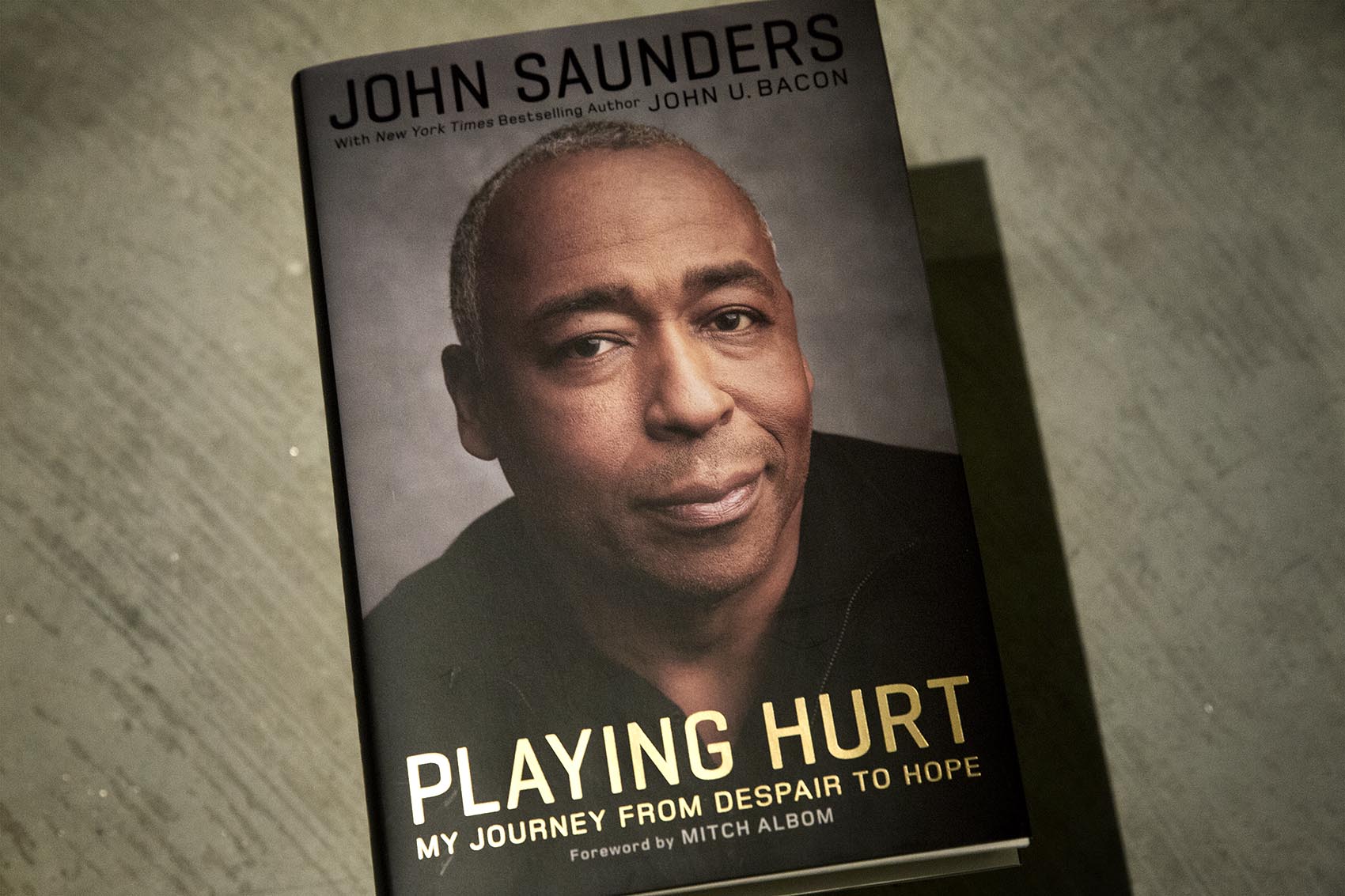 "Playing Hurt," by John Saunders, with John U. Bacon. (Robin Lubbock/WBUR)