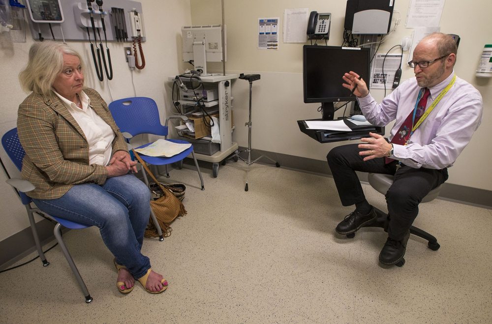 Dr. David Crandell and Jean Marie Hart discuss her status living with Lyme disease during check-up at the Dean Center for Tick Borne Illness at Spaulding Rehabilitation Hospital. (Jesse Costa/WBUR)