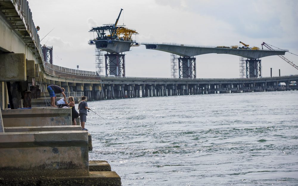 Construction is underway to replace a bridge that caries North Carolina's Highway 12 over the Oregon Inlet, between Hatteras and Bodie islands, at a cost of nearly $250 million. A hundred year bridge that connects two islands that won’t be here in a hundred years, Riggs says. He warned against building it and called for a ferry system instead. (Jesse Costa/WBUR)