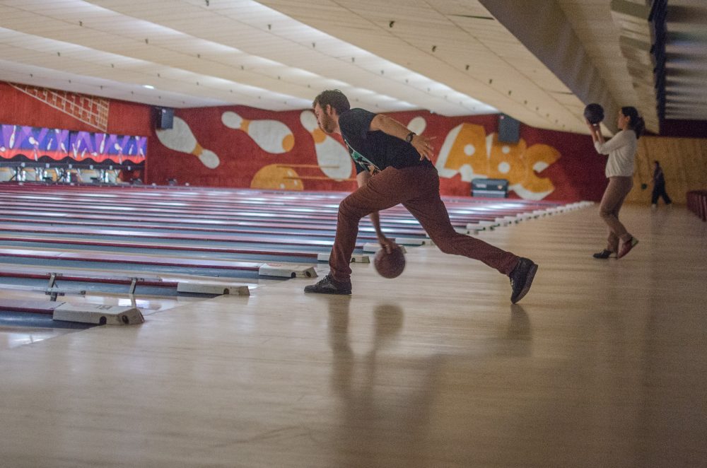 A lot of people say they come for the bowling but stay for the décor. Kyra Shishko of Newton is 26 and has been a Lanes and Games regular since high school: &quot;I don't know if I'm old enough to say it feels like a throwback, but it's nice to not have it be obnoxiously trendy.&quot; (Sharon Brody/WBUR)