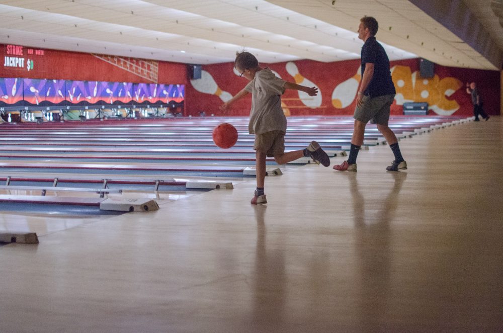 There is no one right way to bowl. 8 year old Eddie Paget, at Lanes and Games with his family for a farewell experience, has developed his own style. He says he is having fun...&quot;except I am losing!&quot; (Sharon Brody/WBUR)