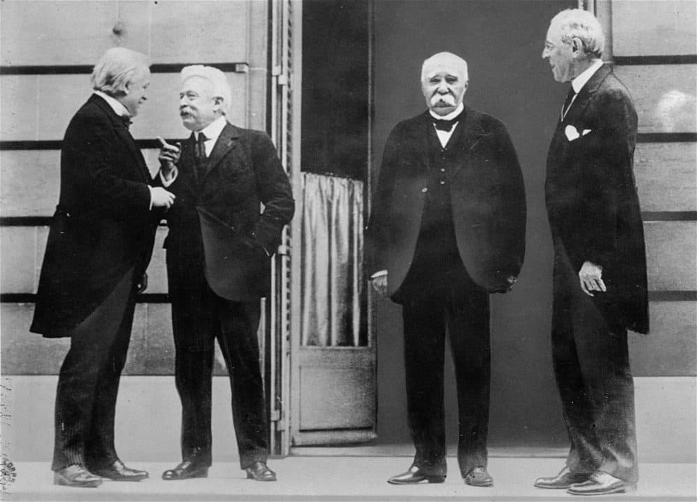 The Big Four of the Allies chat while gathering in Versailles for the Treaty of Versailles, which officially ended World War I, in this 1919 photo. They are, left to right, David Lloyd George, of Great Britain, Vittorio Orlando, of Italy, Georges Clemenceau, of France, and Woodrow Wilson, United States President. (AP Photo)