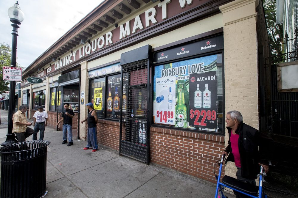 You could see the ad partially, behind the Grey Goose and Bacardi ads, on the window at Chauncy Liquor Mart. (Jesse Costa/WBUR)