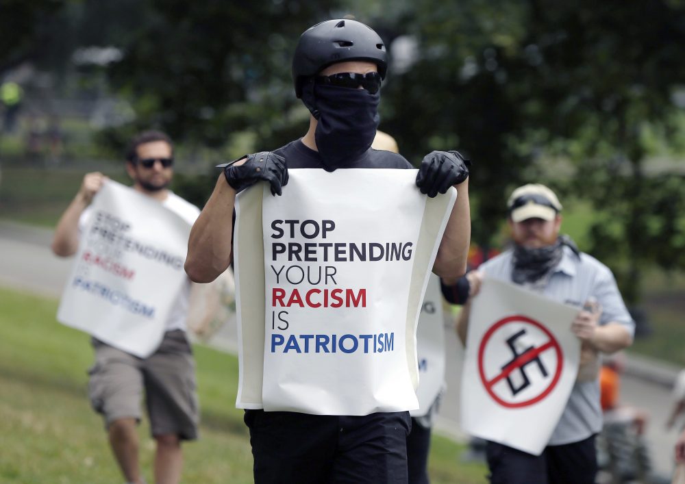 Counter-protesters on the Common. (Michael Dwyer/AP)