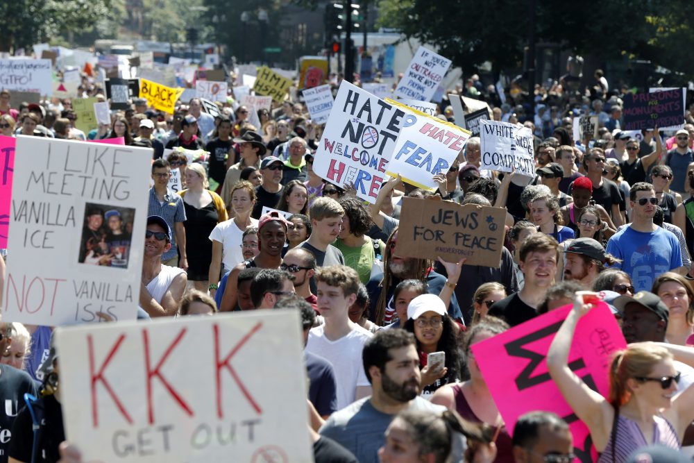 Counter-protesters stand on the periphery of the rally. (Michael Dwyer/AP)