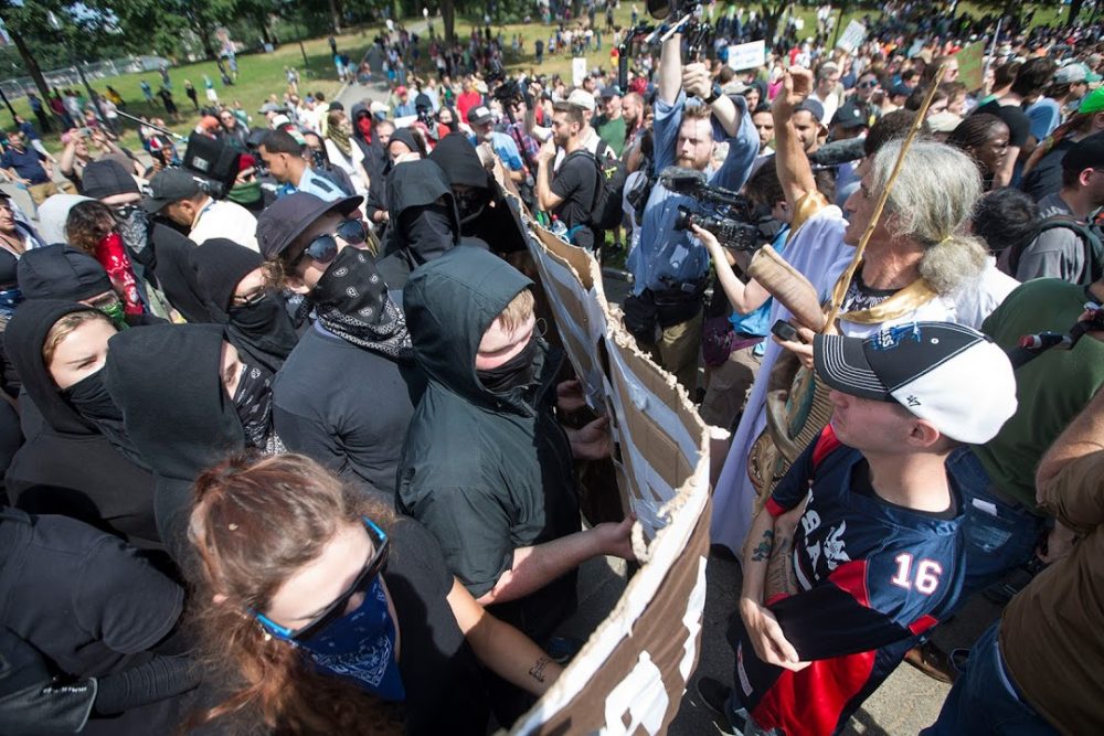 Anti-Fascist counter protesters move in to confront Free Speech supporters. (Jesse Costa/WBUR)