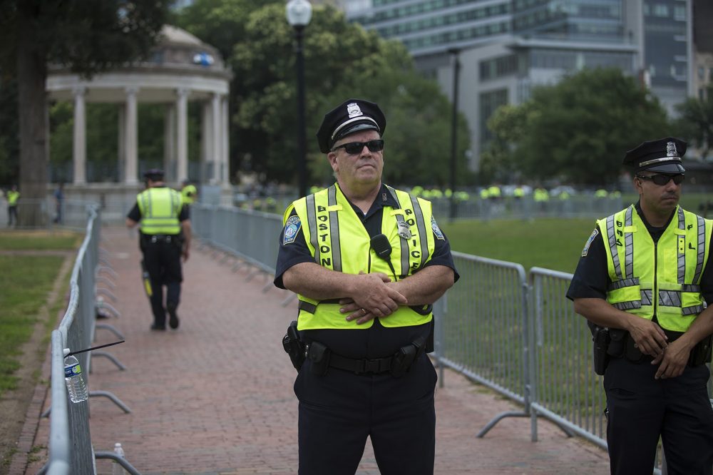 Police stand watch at the Parkman Bandstand at the Boston Common. (Jesse Costa/WBUR)