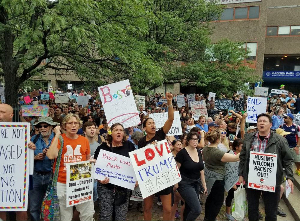 Large crowds are rallying in front of Madison Park High School in opposition to the so-called free speech rally on Boston Common. (Zeninjor Enwemeka)