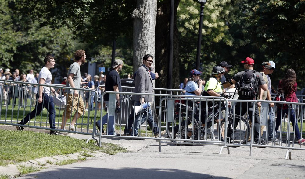 Organizers depart the so-called free speech rally on Boston Common just before 1 p.m. They were expected to stay until 2 p.m. (Michael Dwyer/AP)